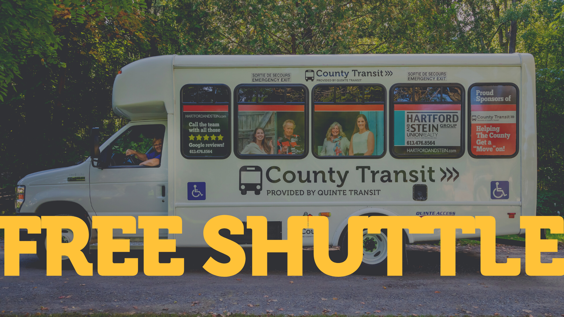 The County Transit bus parked in front of trees. Text on image says "Free Shuttle"